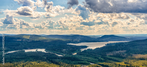 panorama view of endless forest landscape with lakes and rivers on the valley bottom