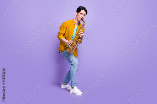 Sticker Full length photo of young man happy positive smile play sax jazz artist isolate