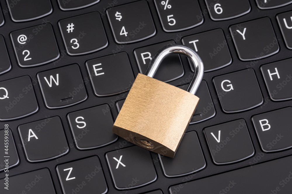 Computer security concept. Padlock on black laptop keyboard Computer security concept. Padlock on black laptop keyboard