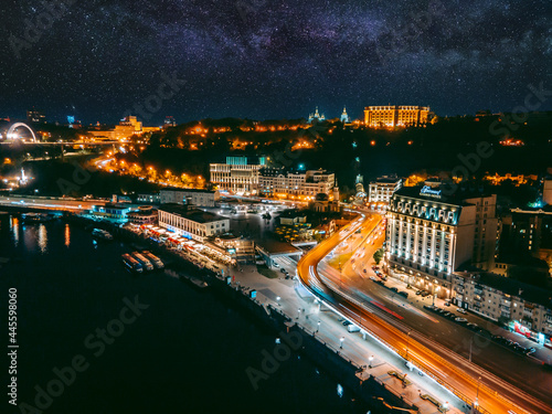 Aerial view from a drone of the embankment and the center of Kiev at night photo