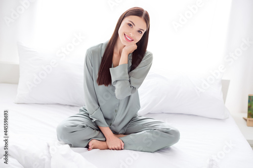 Full length body size photo woman sitting on bed in the morning on weekend