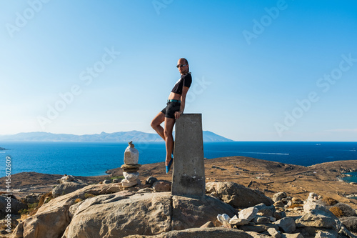 Young Gay Man Posing on top of Delos Island, Greece photo