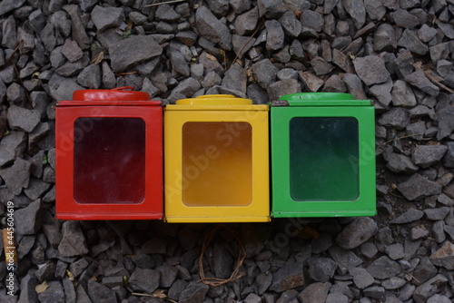 close-up of rubik's cube on stone texture background. green, yellow and red rectangles.