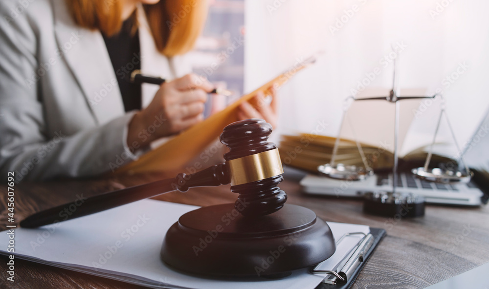 justice and law concept.Male judge in a courtroom on wooden table and Counselor or Male lawyer working in office. Legal law, advice and justice concept. justice and law concept.Male judge in a courtroom on wooden table and Counselor or Male lawyer working in office. Legal law, advice and justice concept.