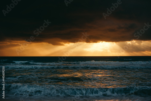 Landscape of amazing sunset, sunrise over the sea with dramatic sky clouds. Sunrise shot on the beach