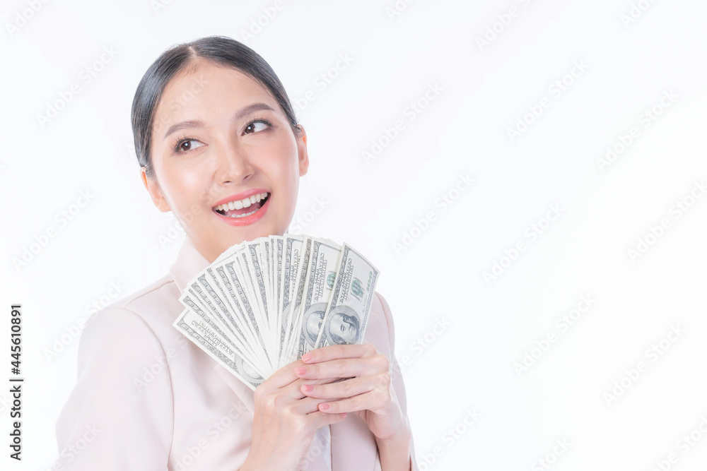 Successful beautiful Asian business young woman holding money US dollar bills in hand , business concept Successful beautiful Asian business young woman holding money US dollar bills in hand , business concept