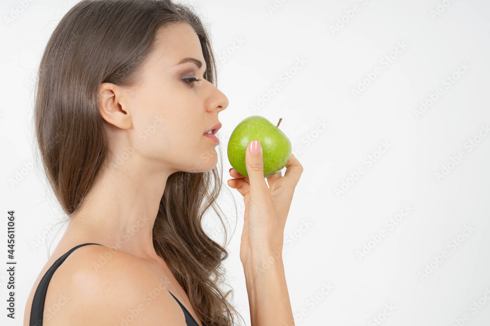 Beautiful body beauty sexy woman slim holding green apple isolated on white background - wellness girl weight loss and healthy concept Beautiful body beauty sexy woman slim holding green apple isolated on white background - wellness girl weight loss and healthy concept
