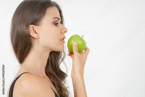 Beautiful body beauty sexy woman slim holding green apple isolated on white background - wellness girl weight loss and healthy concept