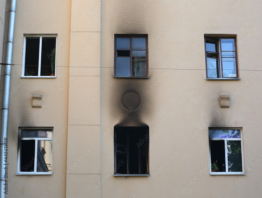 Burnt windows of a residential building after a fire, Malookhtinsky Prospekt, St. Petersburg, Russia, July 2021