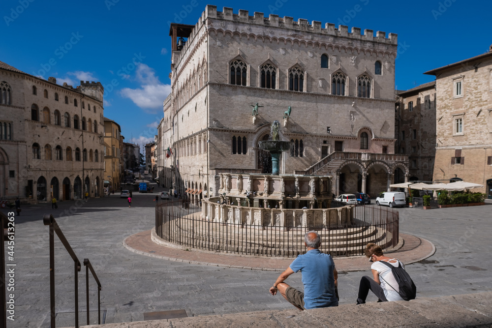 Couple Of Tourists Looking At Main Square City of Perugia Umbria Italy