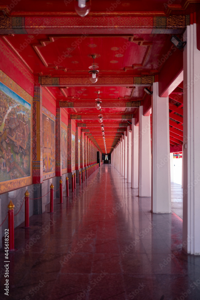 temple walkway at Wat Pa Lelai Worawihan. wall decorated with Khun Chang Khun Phaen classical literature beside temple hall, public landmark at Suphanburi, Thailand temple walkway at Wat Pa Lelai Worawihan. wall decorated with Khun Chang Khun Phaen classical literature beside temple hall, public landmark at Suphanburi, Thailand