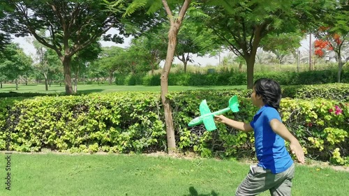 child playing with a aeroplain photo