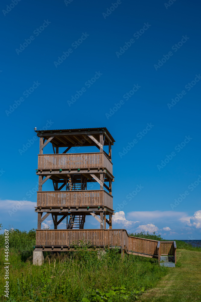 Wooden watchtower in Kolkja next to lake Peipus on a sunny summer day.
