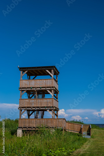 Wooden watchtower in Kolkja next to lake Peipus on a sunny summer day. © Aimur