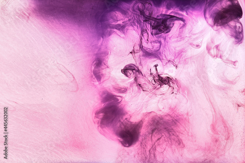 Abstract pink purple cloud of smoke, paint in water background. Fluid art wallpaper, liquid vibrant bright colors. Concept aphrodisiac perfume photo