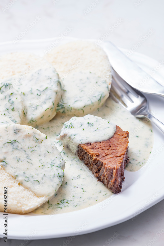 beef meat with dill sauce and dumplings