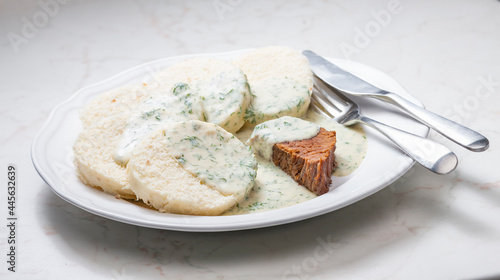 beef meat with dill sauce and dumplings photo