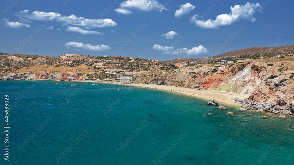 Obraz premium Aerial drone photo of scenic colourful volcanic rocky bay and emerald sandy beach of Paleochori a natural vacation paradise with resorts and water sport facilities in island of Milos, Cyclades, Greece