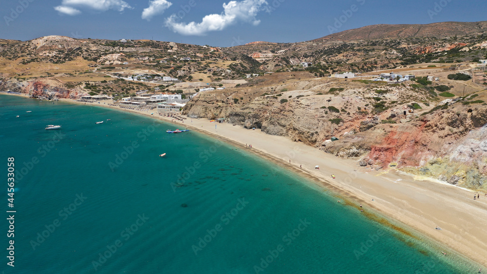 Aerial drone photo of scenic colourful volcanic rocky bay and emerald sandy beach of Paleochori a natural vacation paradise with resorts and water sport facilities in island of Milos, Cyclades, Greece