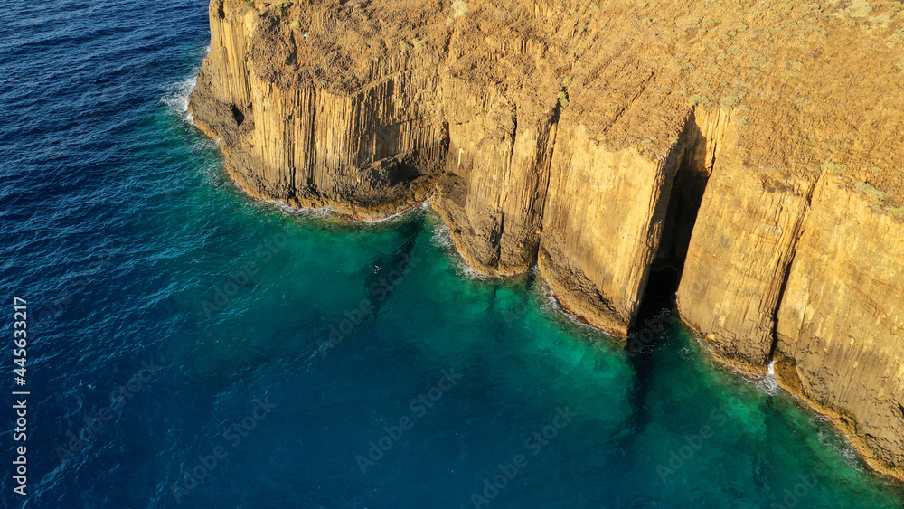 Obraz premium Aerial drone photo of unique rocky volcanic Glaronisia or Sea Gull islets formed thousand years ago creating a beautiful stone arch in island of Milos, Cyclades, Greece