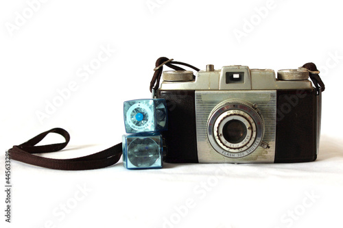 old vintage film camera with flashcubes on white with copy space