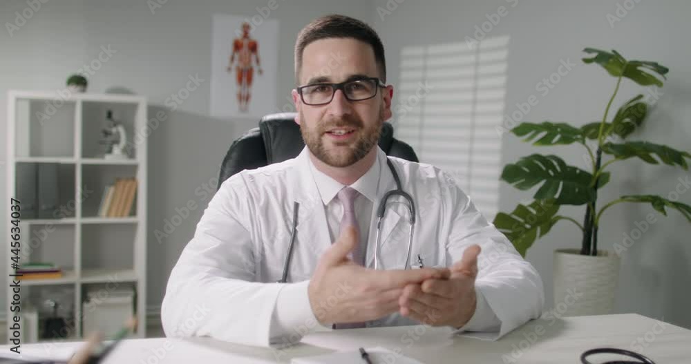 Doctor is consulting a patient in video chat. healthcare service worker talking to a patient and gesturing - online medicine, health and safety 4k footage Doctor is consulting a patient in video chat. healthcare service worker talking to a patient and gesturing - online medicine, health and safety 4k footage