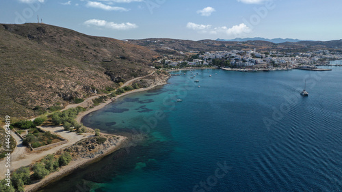 Aerial drone photo of picturesque village of Adamantas main port a natural calm sea bay and safe anchorage of yachts and sail boats in volcanic island of Milos, Cyclades, Greece
