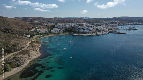 Fototapeta Naklejka Na Ścianę i Meble -  Aerial drone photo of picturesque village of Adamantas main port a natural calm sea bay and safe anchorage of yachts and sail boats in volcanic island of Milos, Cyclades, Greece