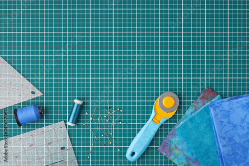 Home craft concept photo - patchwork  or quilt  tools and textile set flatlay.
