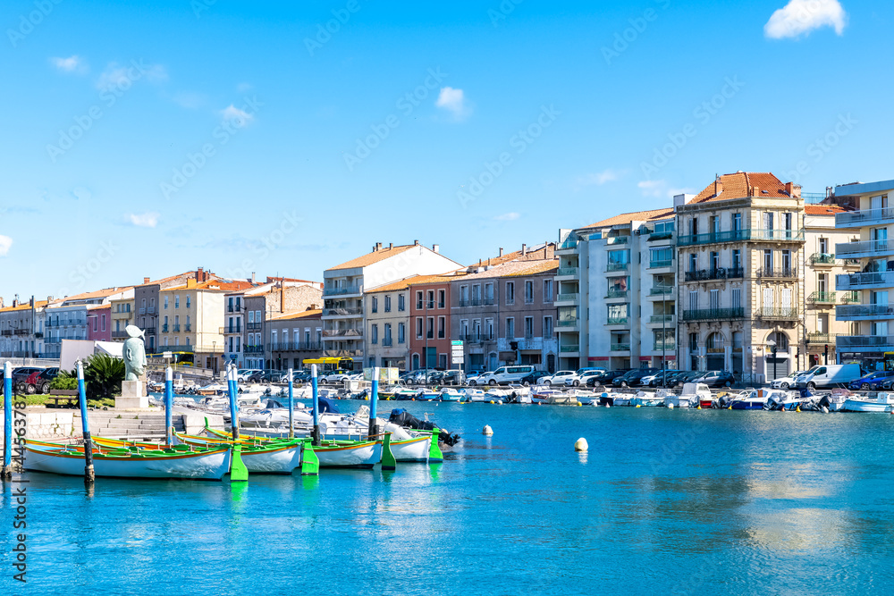 Sète in France, traditional boats moored at the quay in the city centre

