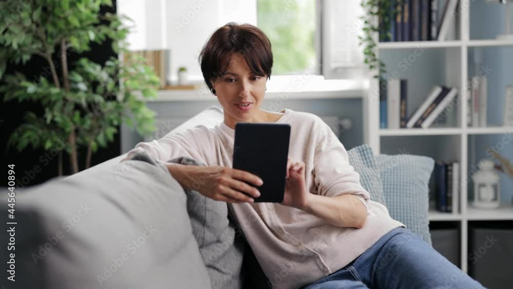 Woman using tablet at home Woman using tablet at home