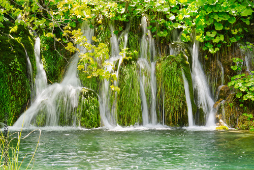 Waterfall in Plitvice Lakes national Park at summer  Croatia. Waterfalls formed by mountain lakes due to melting glaciers