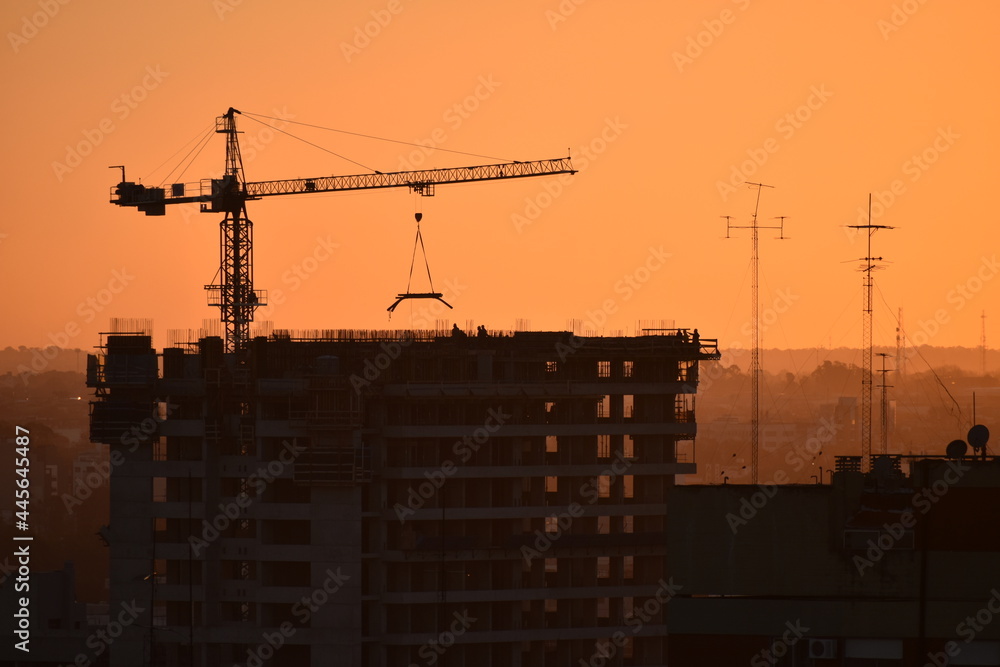 construction of a high-rise with a crane in evening light, Buenos Aires construction of a high-rise with a crane in evening light, Buenos Aires