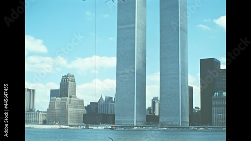 Archival of Manhattan skyline, sea view from Hudson river sightseeing cruise. Old Twin Towers skyscrapers and office buildings of New York city. United States America in 1976.
