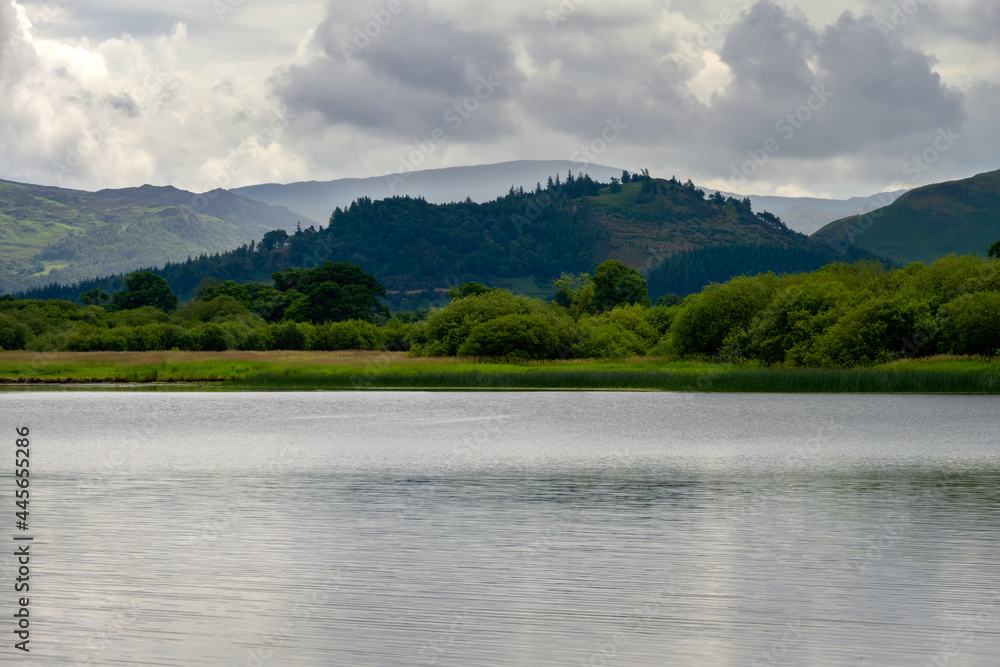 View of Bassenthwaite Lake  surrounded by hills on a cloudy summer afternoon, Lake district, England