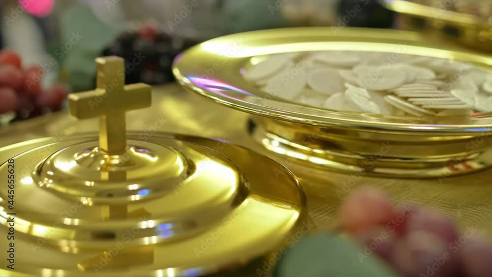 Christian Communion, top view of a golden cross, sacramental bread and wine on a box Christian Communion, top view of a golden cross, sacramental bread and wine on a box