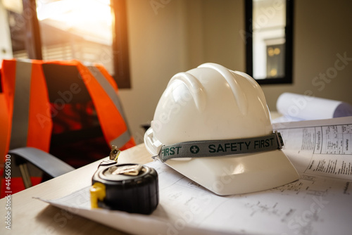 Working tools Engineer office desk with helmet at desk talbe photo