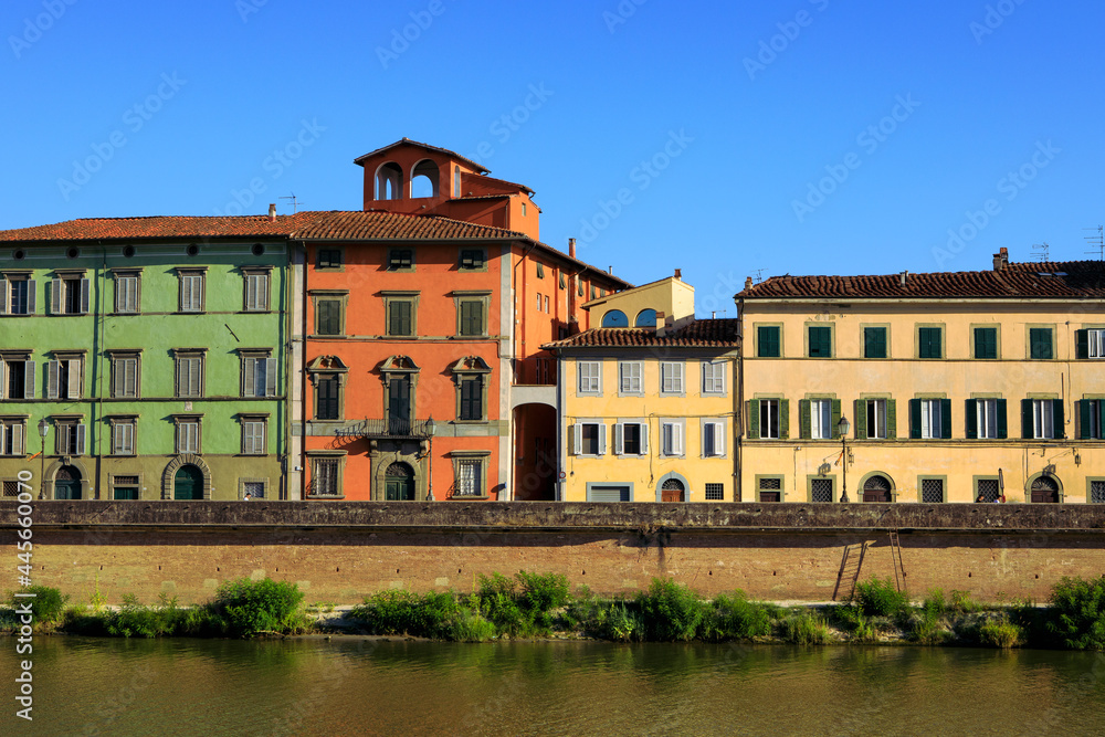 Colorful historical buildings facades in Pisa.