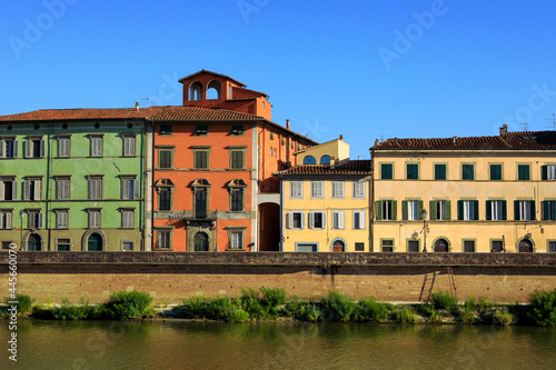 Colorful historical buildings facades in Pisa.
