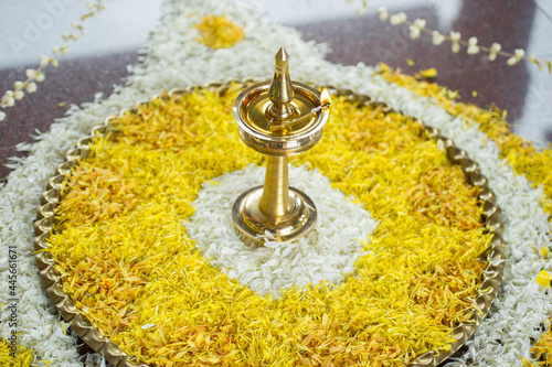 Traditional brass oil lamp during a Hindu wedding ceremony photo