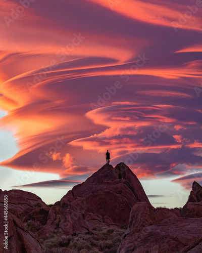 Beautiful Sierra Wave of California sunset with orange lenticular clouds burning in the sky photo