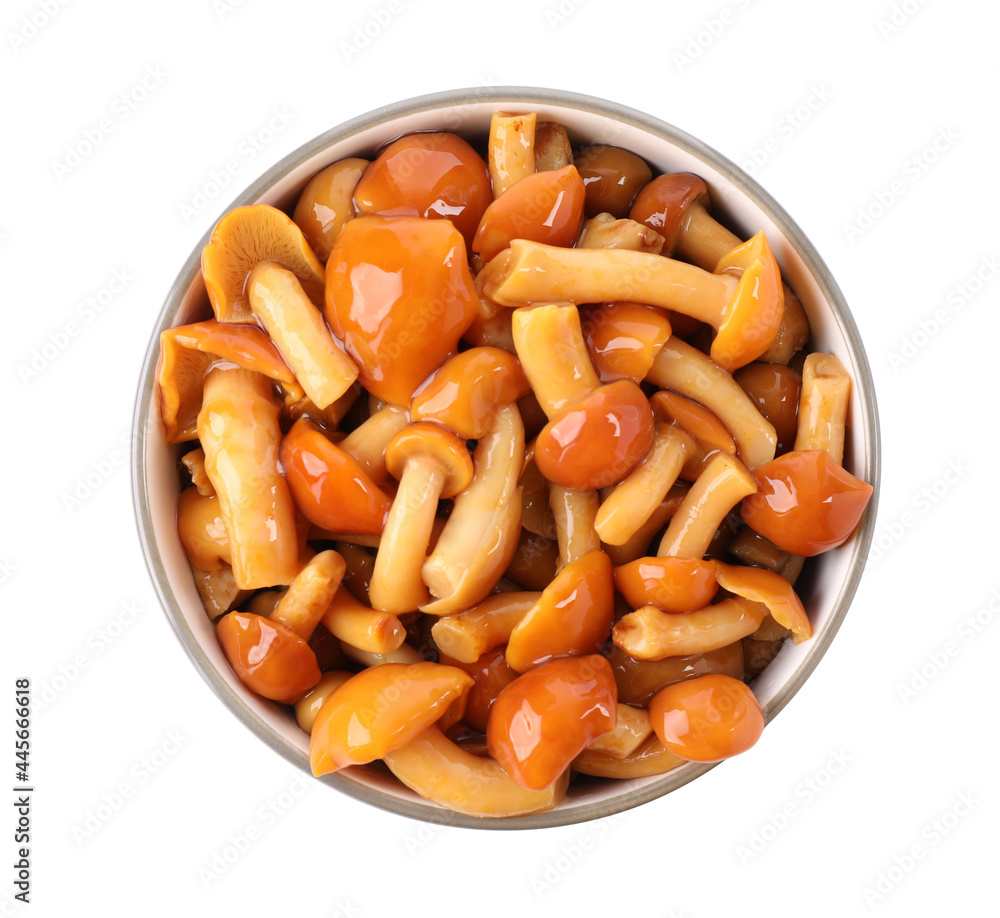 Tasty marinated mushrooms in bowl isolated on white, top view Tasty marinated mushrooms in bowl isolated on white, top view