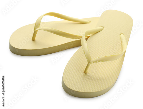 Stylish yellow flip flops on white background. Beach object