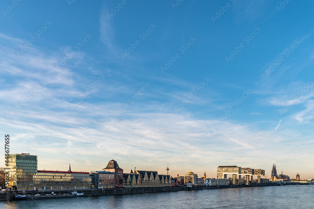 Beautiful view of Rhine in Cologne, Germany under blue sky and white clouds