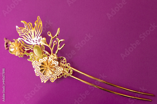 Картината върху платно Chinese hairpin hair clips on a purple background