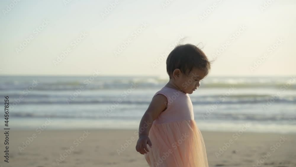 Portrait of a little girl enjoying a vacation on the beach enjoy playing with sand Portrait of a little girl enjoying a vacation on the beach enjoy playing with sand
