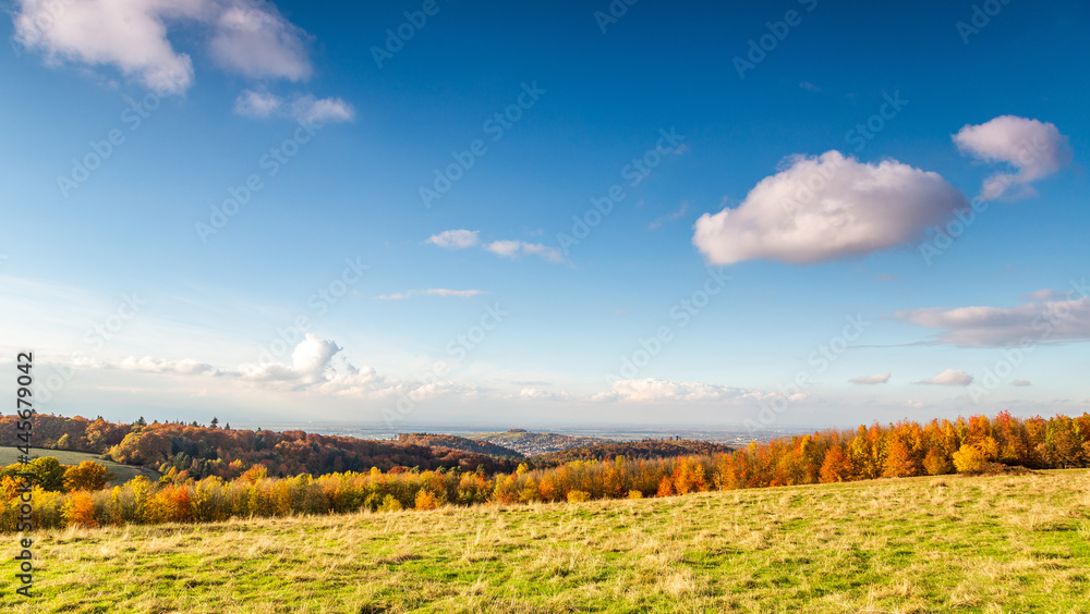 Mountain area in Freiburg, Germany in autumn, with white clouds in the clear sky