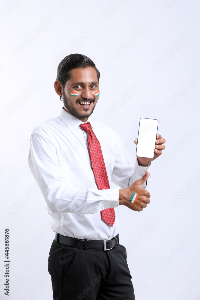 Independence day offer concept : Young indian showing smartphone. Independence day offer concept : Young indian showing smartphone.