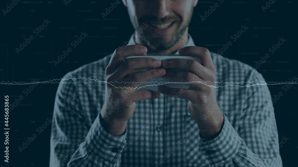 Statistical graphs over caucasian man using smartphone against black background Statistical graphs over caucasian man using smartphone against black background