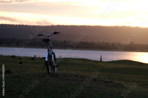 foldable mini bike In a wide field in the morning sun photo